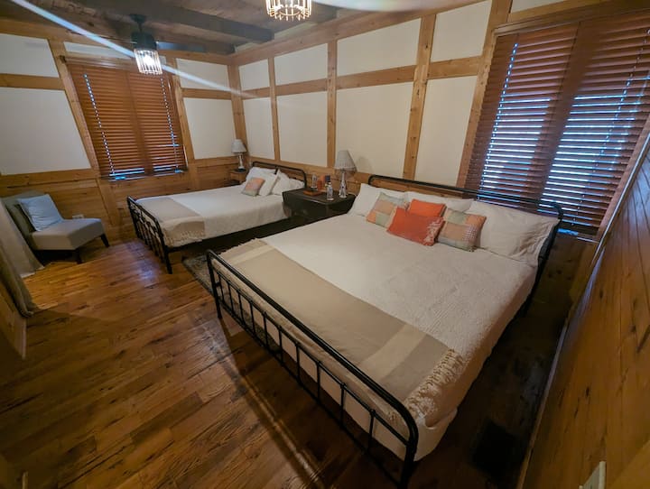 Grotto Room Beds: King & Queen
Grotto bedroom sleeps one to four people (one King bed & one Queen bed). 
 Private bathroom with wall-mounted sink & curbless walk-in shower.