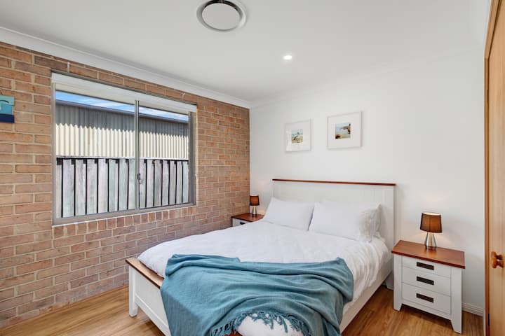 One Queen bed with a built in wardrobe for storage.