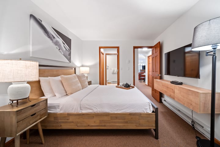 Relax in the spacious main queen bedroom featuring a private en-suite bathroom for added comfort and privacy.