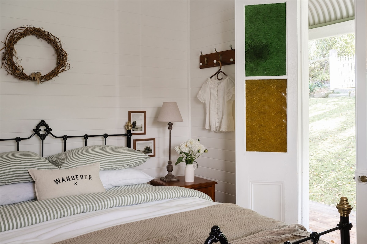 Bedroom 1 - a queen bed and french doors out to the verandah