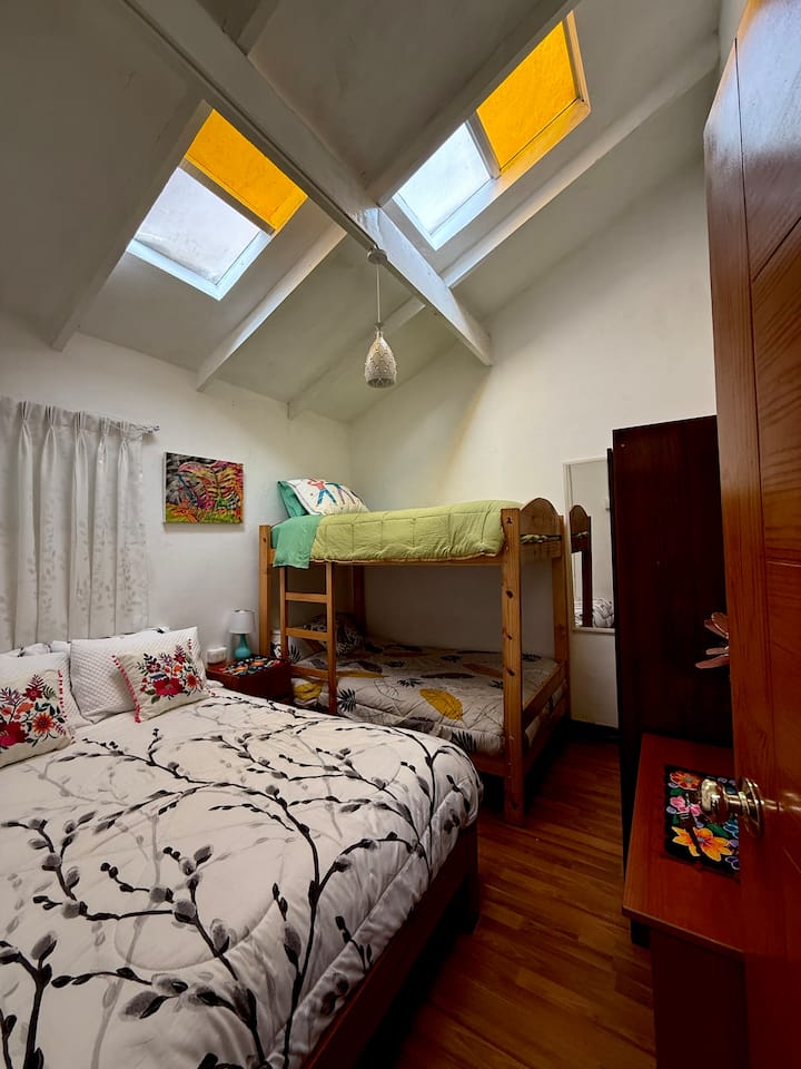 Bedroom # 2 with a queen size bed, bunkbed and other details. This room has no windows, it takes natural light from the skylights above.