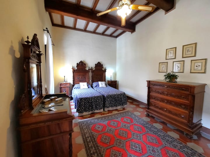 AC twin-double room on the mezzanine . Beds can be joined on request