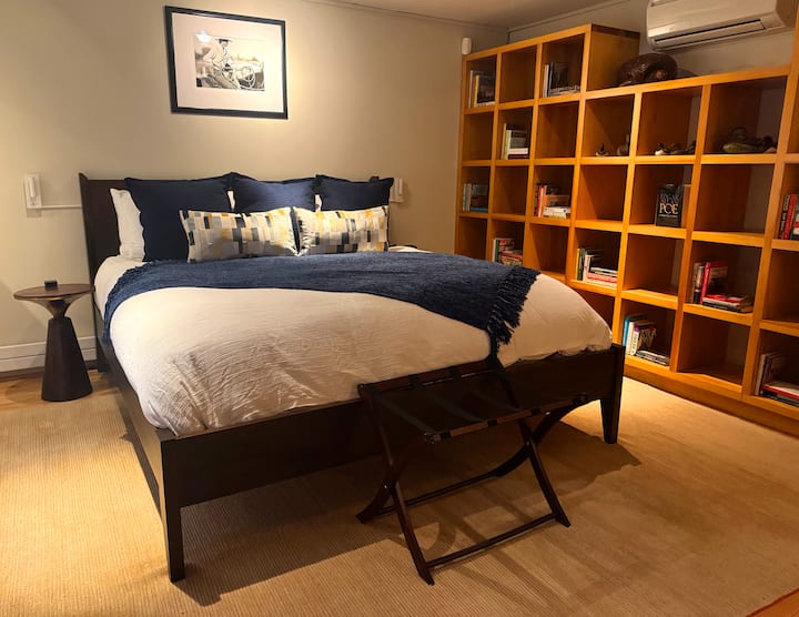 Primary bedroom with a king bed, down comforter and a Samsung SmartTV.. 