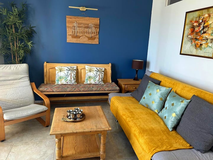 Living room with sofa bed, bench and chairs