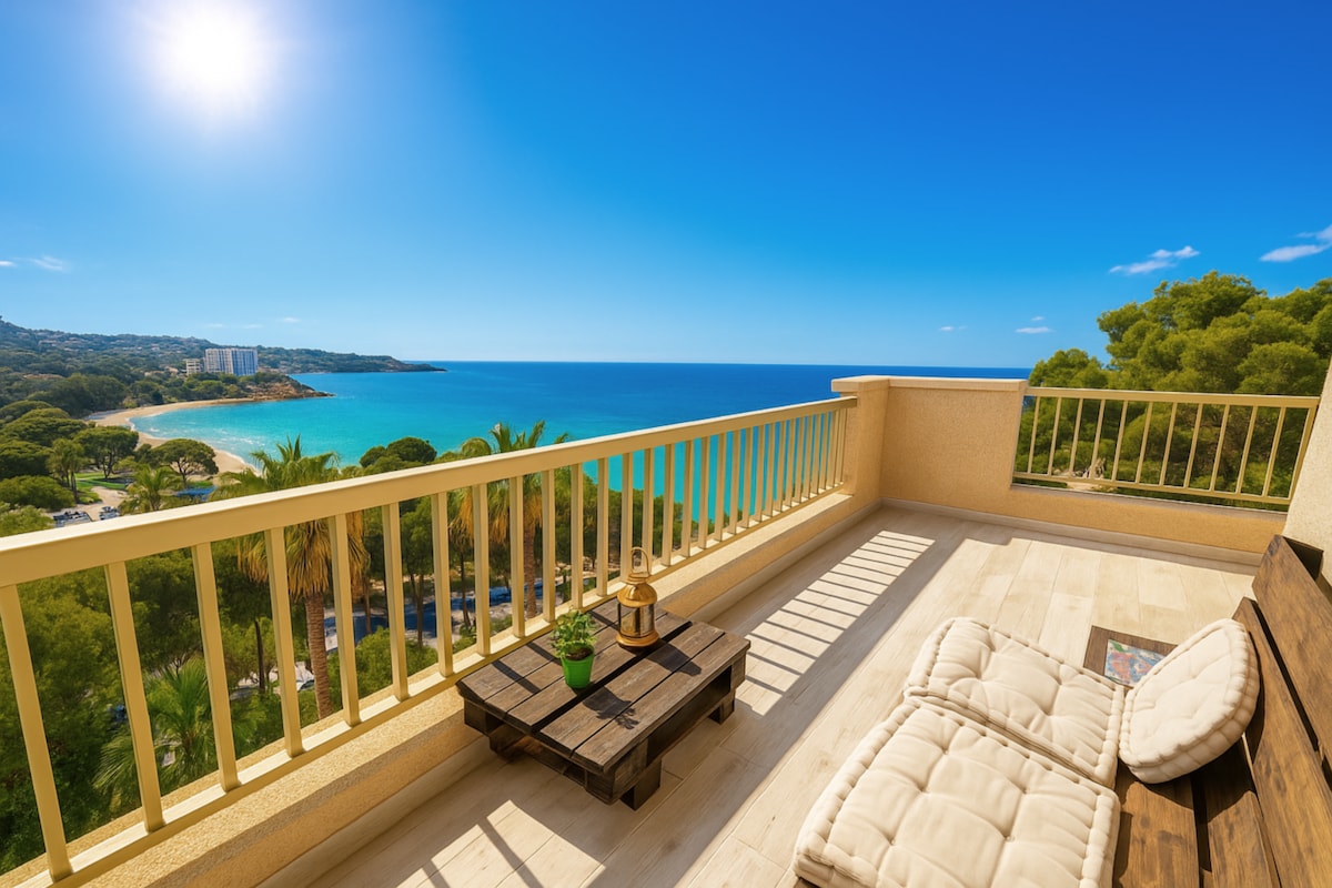 A spacious terrace is featured with unobstructed sea views and abundant sunlight. Comfortable seating arrangements provide a relaxed atmosphere, surrounded by greenery and coastal scenery. The clear blue sky and gentle waves create a serene backdrop for outdoor enjoyment.