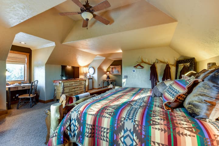 Private Master Suite, this 600 sq ft room features a luxury king bed, 48 inch flatscreen TV, Swivel chair for reading, a computer work station, complimentary coffee, under counter refrigerator,  and a private spacious bathroom.  