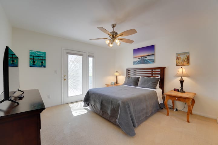 Bedroom 2 has a Queen sized bed.  Smart TV (no cable) and an attached patio that is shared with bedroom 3 and looks out over the backyard