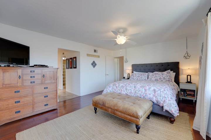 Primary bedroom with California King sized bed and attached full bathroom.  This room has a TV with cable service