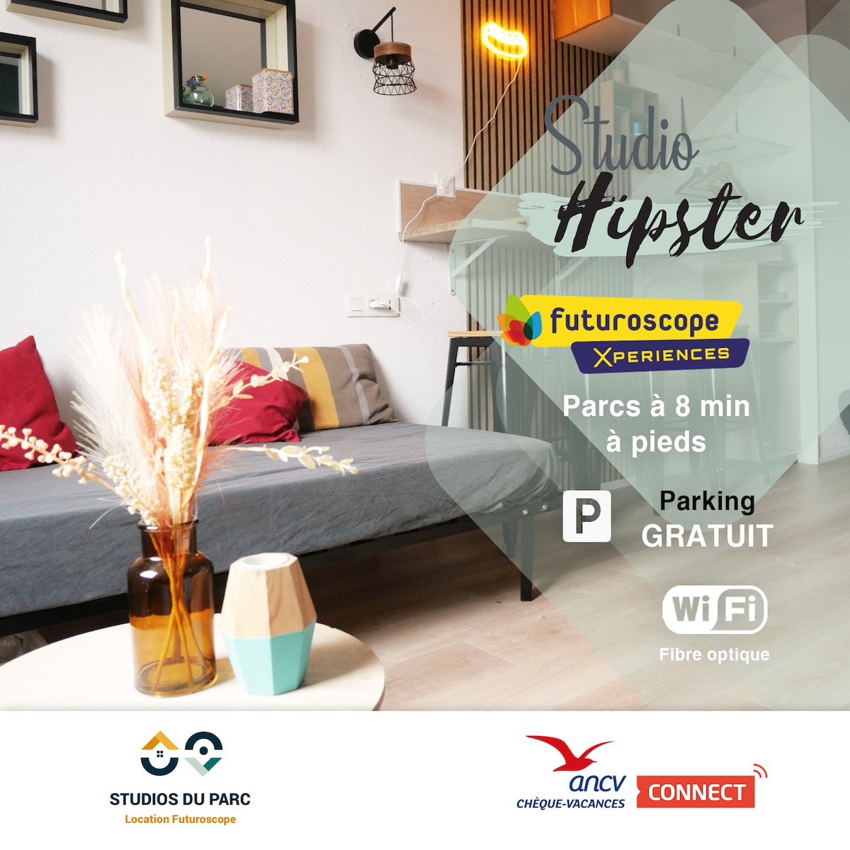 A modern studio setup is showcased, featuring a comfortable sofa and a small table adorned with decorative plants. Nearby, a vibrant vase adds a pop of color. Amenities are displayed, confirming proximity to attractions, free parking, and WiFi access.