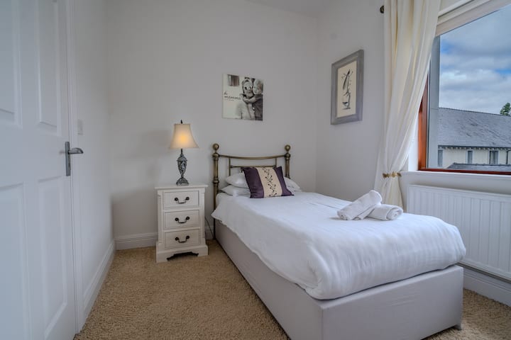 Single bedroom with blackout rollerblinds. This bedroom has space for a travel cot, which we can provide.