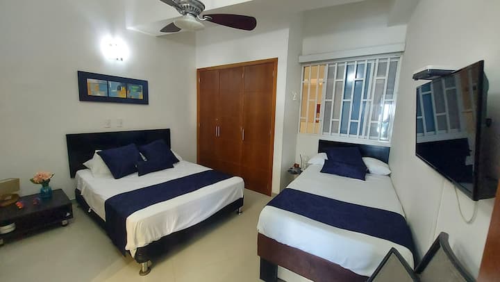 Second Room with full private bathroom. With a double bed and a single bed. 