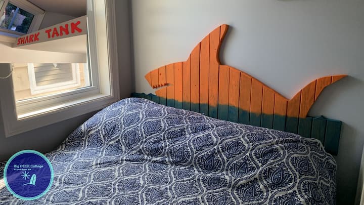 The Shark Tank room is a favourite with the children, with two windows, and a dresser with charging ports for mobile devices. 