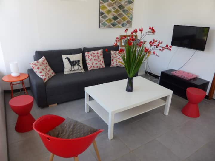 seating area with convertible sofa and large screen TV