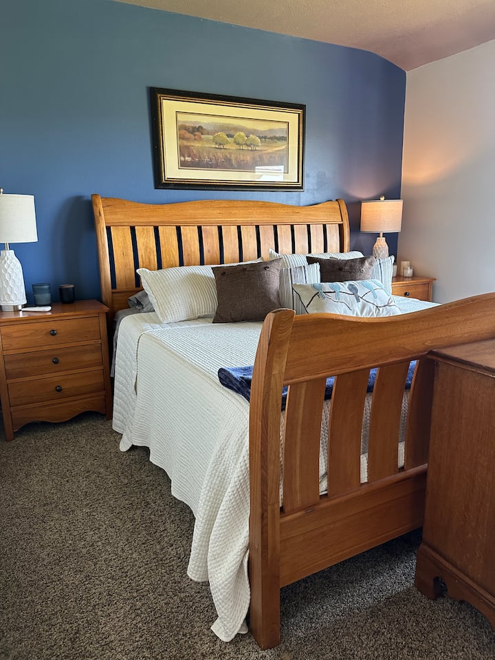 Adjustable split king bed and blackout curtains.