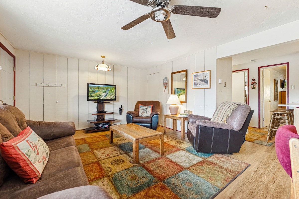 Living room with satellite TV, wifi, pull-out couch with memory foam mattress; great place to relax after daytime activities.