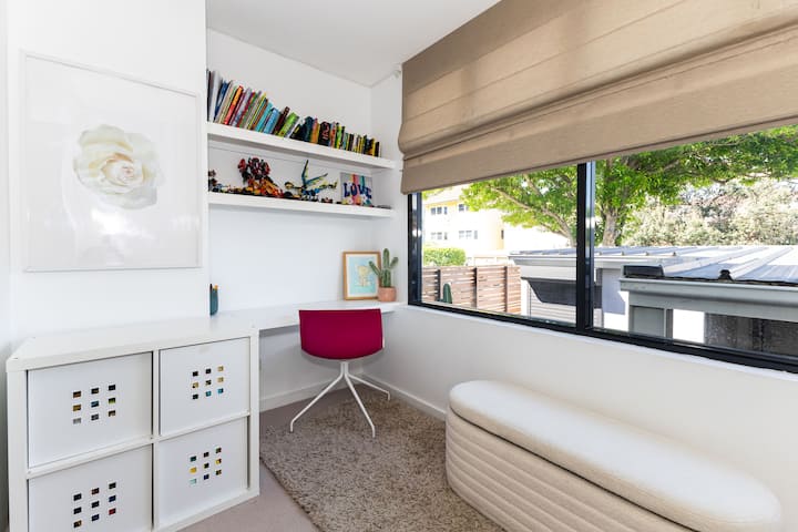 Unwind and relax in the inviting sunroom, an ideal kids retreat. Enjoy entertainment on the frame TV while lounging in comfortable Brosa lounge chairs and beds. 