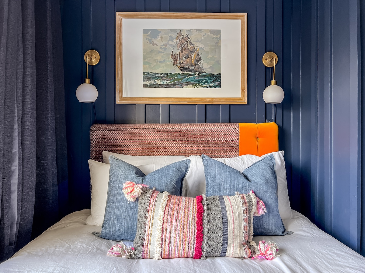 Bedroom 3 features a multi-function design with a cozy, custom headboard with hotel quality linens and a down duvet.  Bedroom 3 also includes a dedicated workspace with a desk, chair, and a smart device to control lighting, music and alarms.