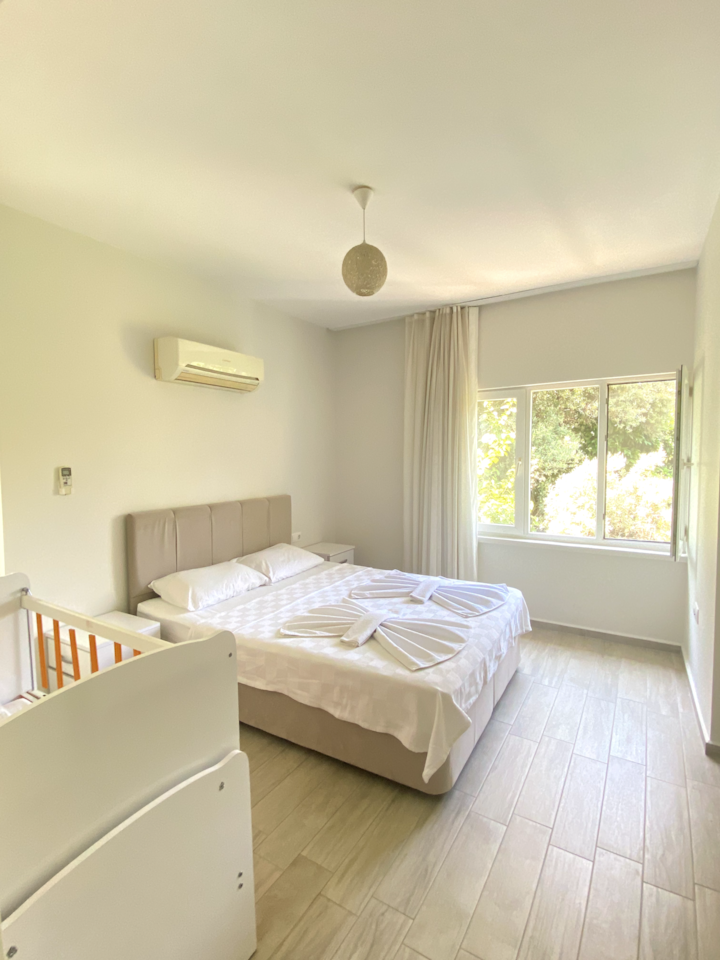 Bedroom 1: 
one double bed, 1 crib, A/C, Iron and Garden View.