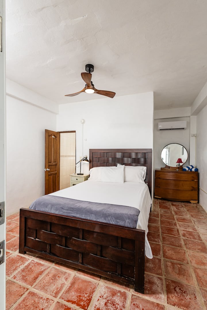 Bedroom 4 offers a comfy queen bed, private ensuite bathroom, and brand-new AC for a cool night’s sleep. 