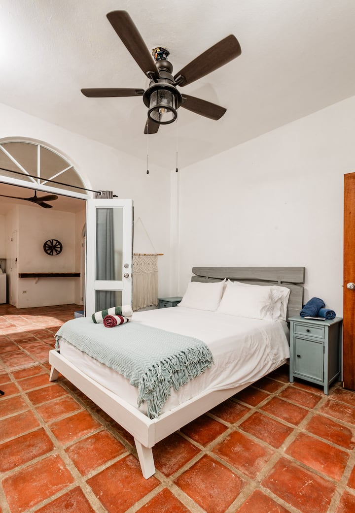 Bedroom 2 features a cozy full bed and direct access to the outdoor patio—perfect for morning coffee or evening breezes. Shares a Jack-and-Jill bathroom with the queen room and includes two beach towels for your seaside adventures.