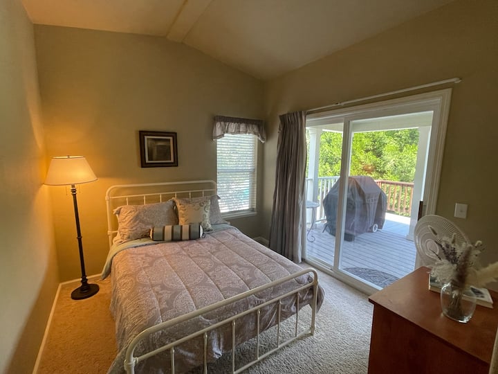 Full size bed. Bedroom is adjoining to the master bedroom (divided by a curtain and has it's own entrance from the back deck).