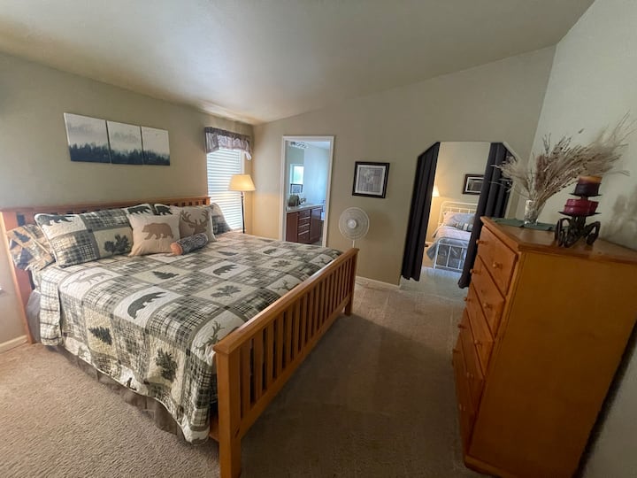 Master bedroom with adjoining bedroom #2 (separated by curtain and has its own entrance from the back deck).