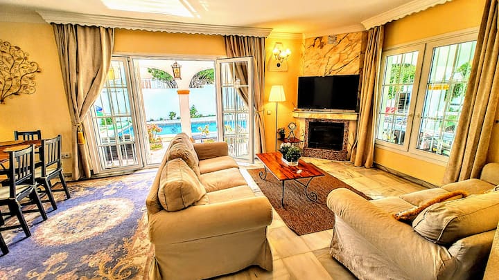 2025  Living room with direct access to the terrace and swimming pool. Marble fireplace, smart TV with Chromecast - you can stream whatever you want from your phone. 2 units of air-conditioning installed in 2021.