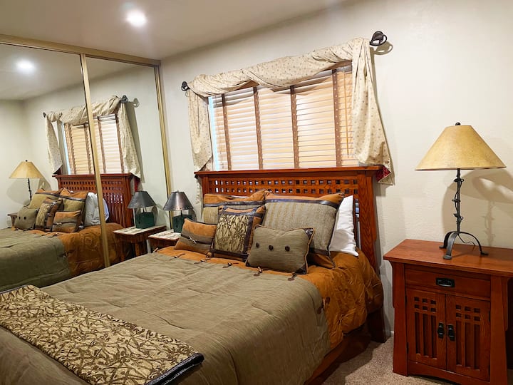 Queen Bedroom with private bathroom, TV with streaming channels and Blue Ray player. The "Pine Tree" room