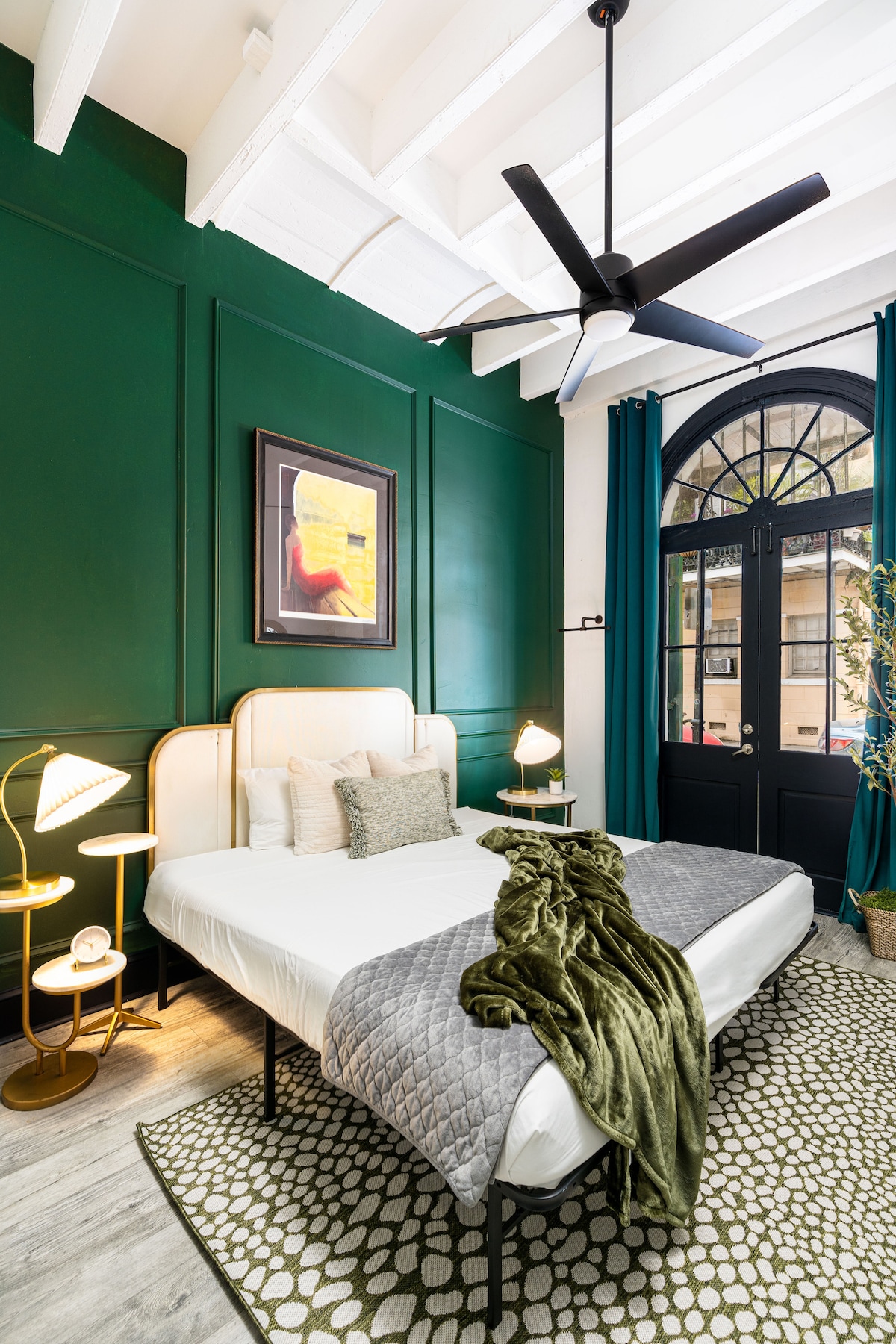 The Primary bedroom features a king size memory foam mattress with hotel grade linens. The original French doors open out to Saint Philip Street so you can feel a part of the action. Or simply shut the shutters and curtains for privacy. 