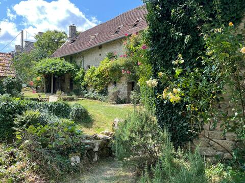 Large charming old house in front of a pond