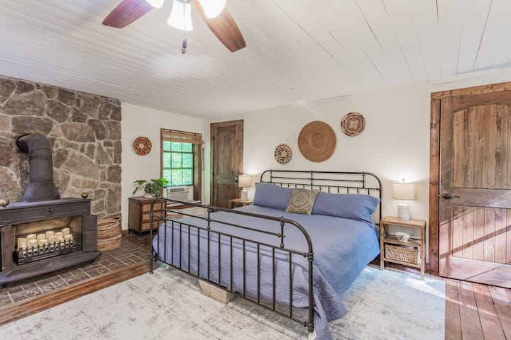 Upstairs master bedroom with stove and closet