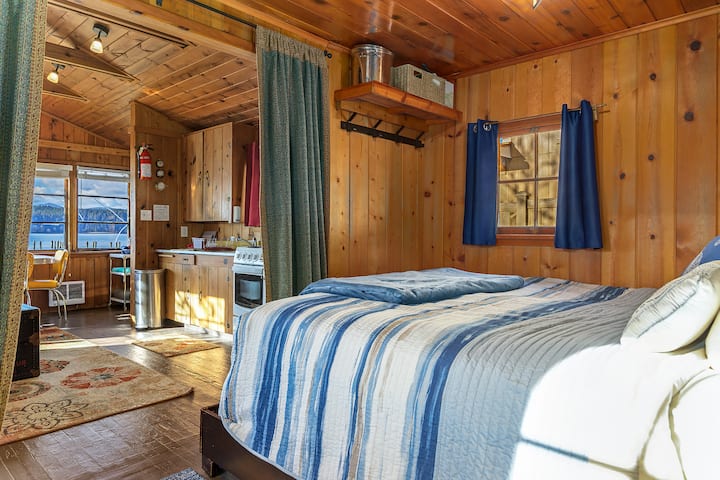 Enjoy a leisure morning in bed with a view of the water.