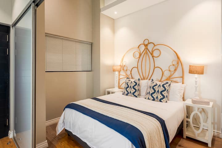Cane headboard sourced from one of Cape Towns top designers.