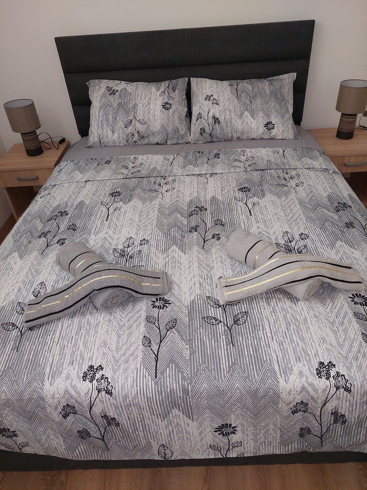 A comfortable 160 cm bed, with accompanying bedside tables, lamps and a spacious wardrobe with a mirror, will give you  all the comfort of your stay and pleasant dreams.
The room has extremely good insulation, as well as a bi-fold PVC window with a protective insect screen.