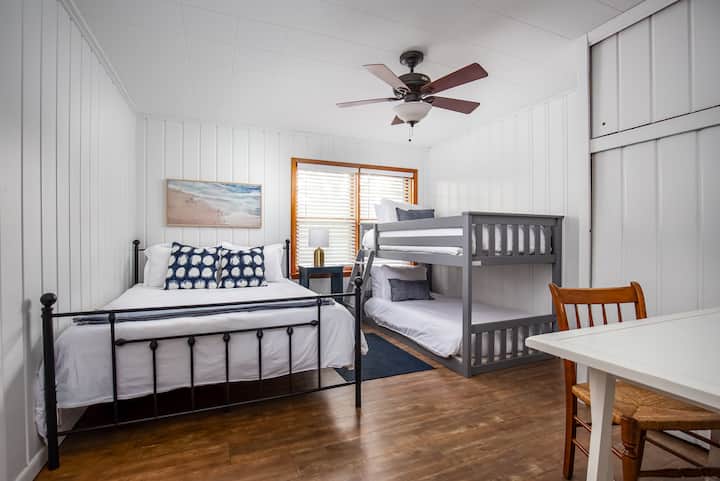 Family bunk room: this room has a queen-size bed and a set of twin bunks. 