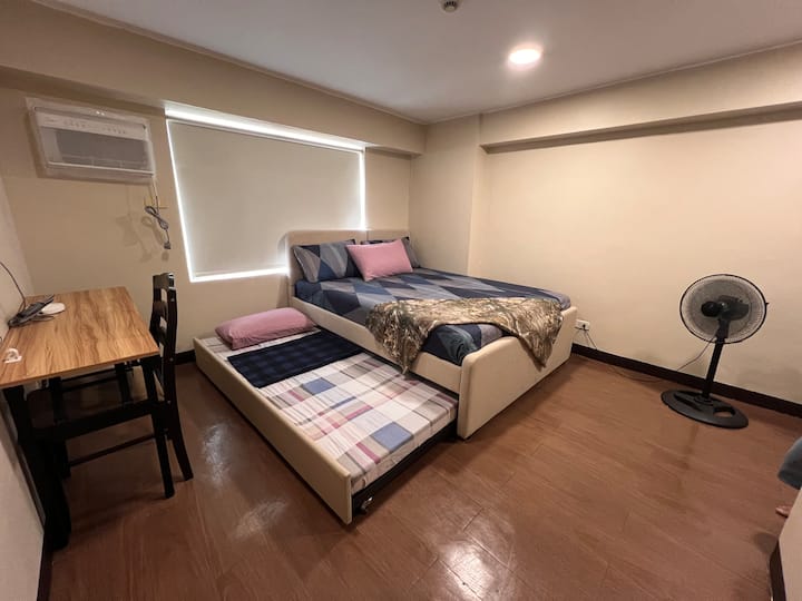 2nd level master bedroom for rest,  work and relax ;  equipped with queen size bed, pullout bed, working table/area, dresser and wardrobe 