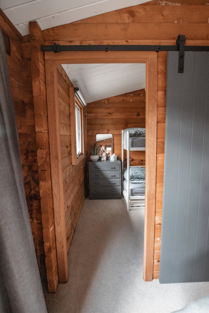 Looking through the second bedroom into the kids bunk room.