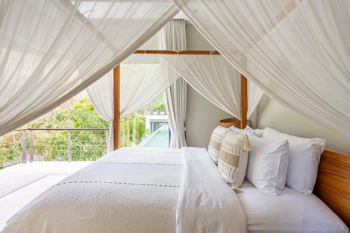 Bedroom 4 has an enviable position by the pool. Verdant inland views.
