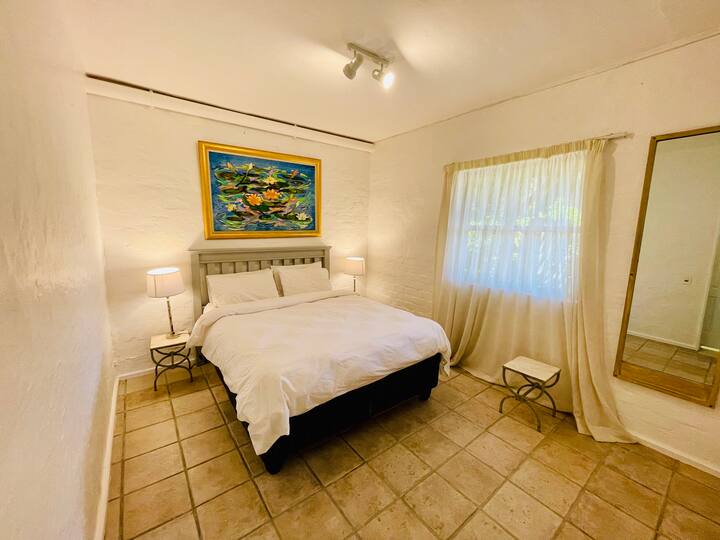 This bedroom is in the downstairs flatlet, complete with living space, kitchenette and en-suite bathroom.