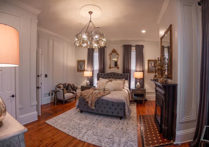 This spacious suite features an adjustable queen size bed with luxurious bedding, fireplace, clothing dresser and closet. The luxurious en suite bath has a spacious shower, double vanity and claw foot tub. Truly fit for a queen!