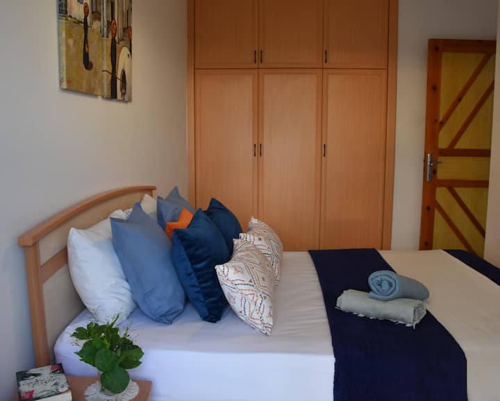 The double bedroom with sea view and fitted wardrobe. 