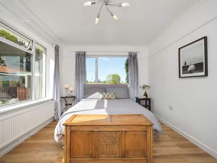 Bedroom 4:  Kingsized bed, double aspect - watch the sun rise and set over the fields!  Desk and art deco wardrobe. Near bathroom with shower.