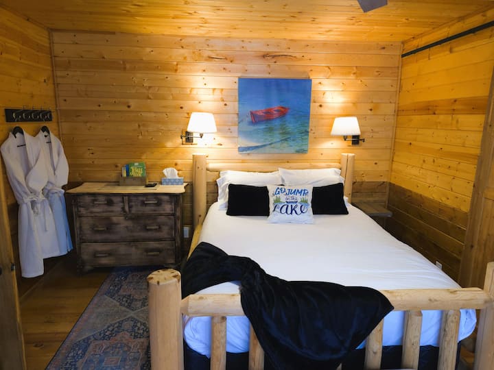 Spacious master bedroom with a Queen bed opens up to a private patio and the sounds and views of the lush forest. Two waffle weave towels for the short trip to the hot tub (just off the master bedroom patio).