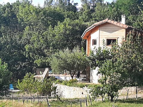 Wooden house surrounded by nature. A haven of peace