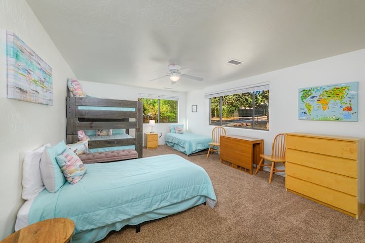 Full size bunk sleeps 3 adults or 4 small kids.
2 Twin beds.
Expandable table that can be moved throughout house and 2 extra chairs. Closet has a wagon, Pack n Play, child seat that an attaches to a chair and some toys.