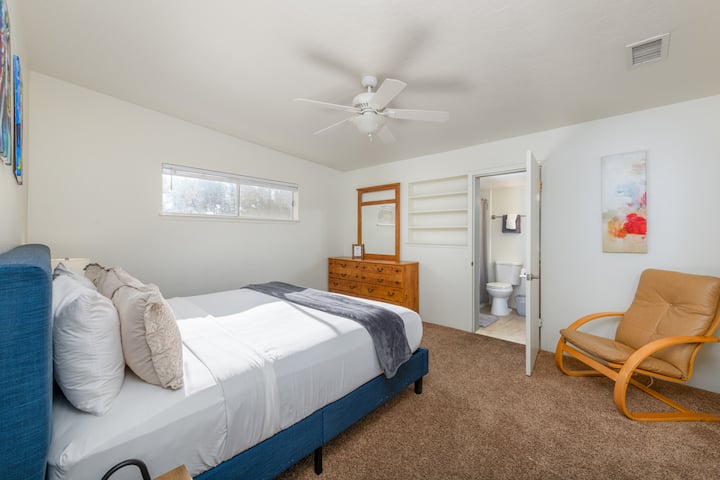 Master bedroom with King bed. Pop-up table in closet for extra work space. Fan, humidifier and ironing board in closet too. Bathroom with shower off this bedroom.