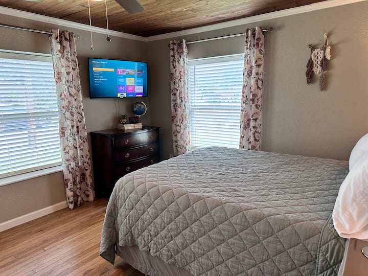 The TV is located in the bedroom.
