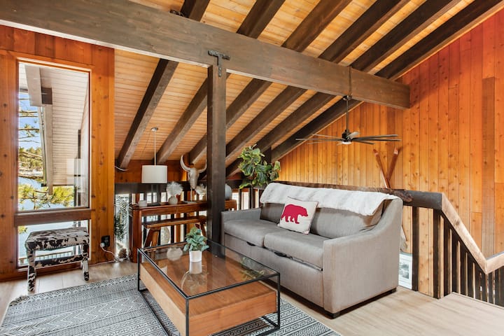 The charming loft overlooks the lake and includes a foosball table, providing endless entertainment.