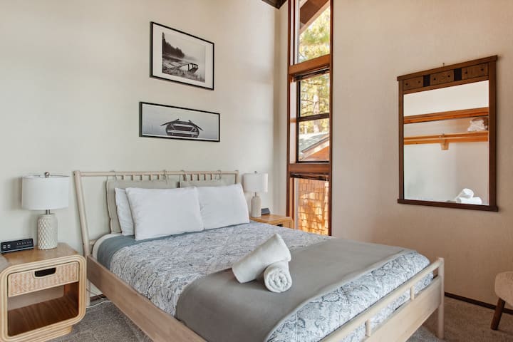 The third bedroom, located on the top floor, features a queen bed and offers some of the home’s most spectacular views.