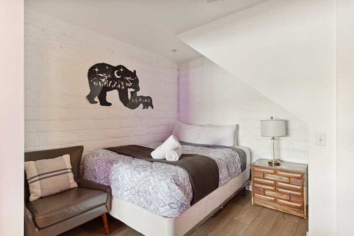 A fourth bedroom is located adjacent to the game room in the basement. A pair of barn doors can be used for privacy. 